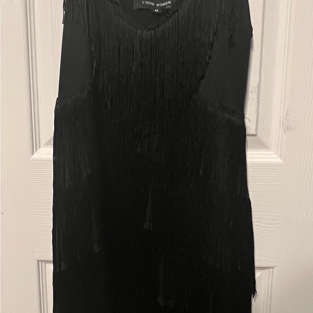 Super cute fringed adjustable strap black dress. Size “M”